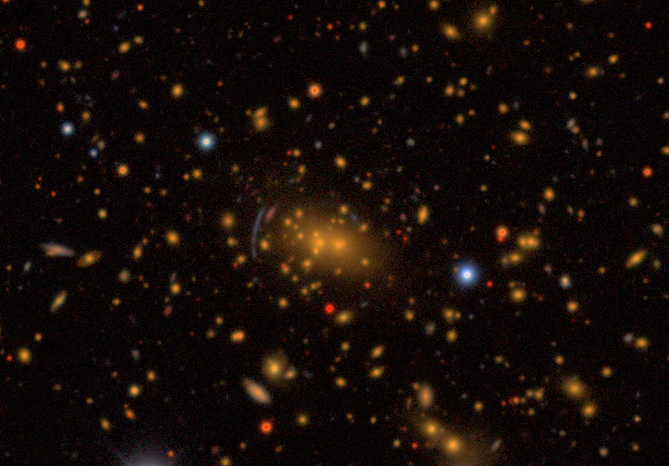 The galaxy cluster  SPT-CL J2138-6007, showing a signature  of strong gravitational lensing.